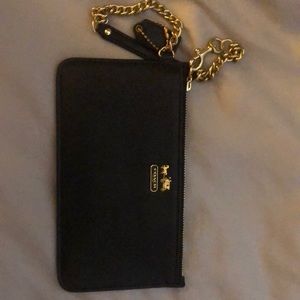 Coach wristlet in black with gold hardware